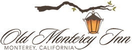 Logo of Old Monterey Inn featuring a lantern and vine design.